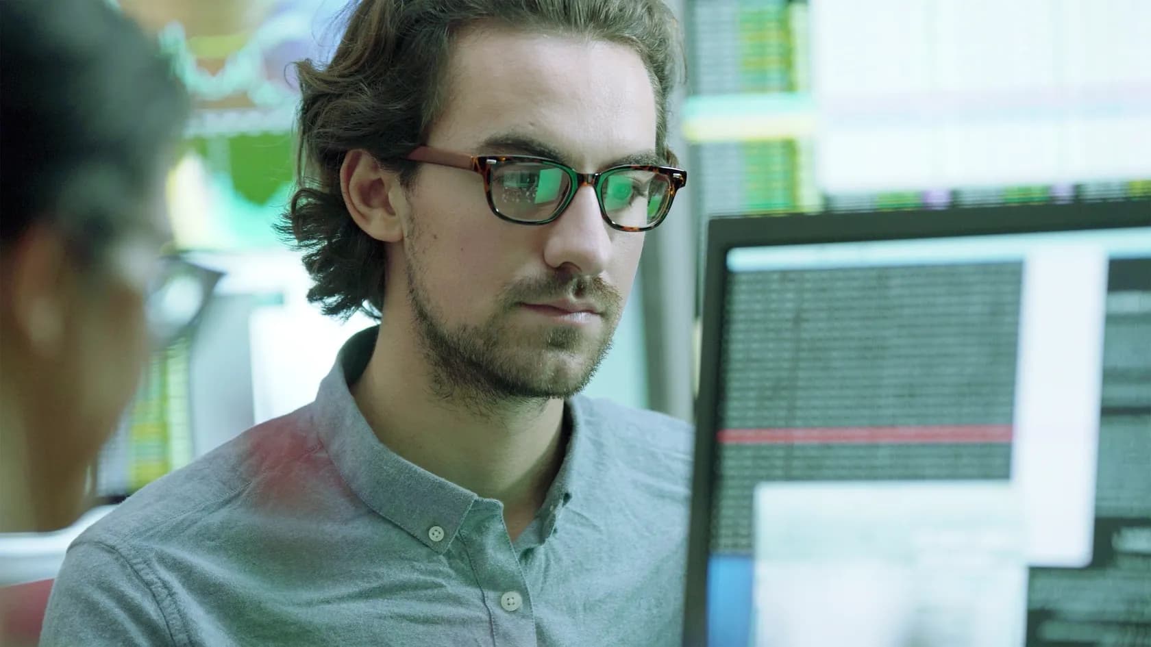 A man analysing a computer