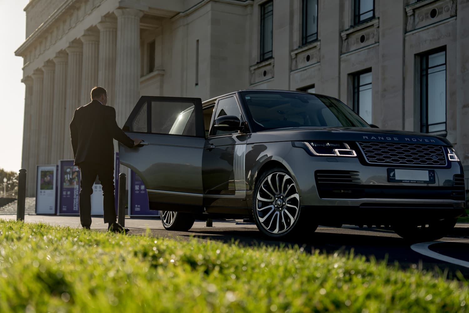 Close protection guard opening car door